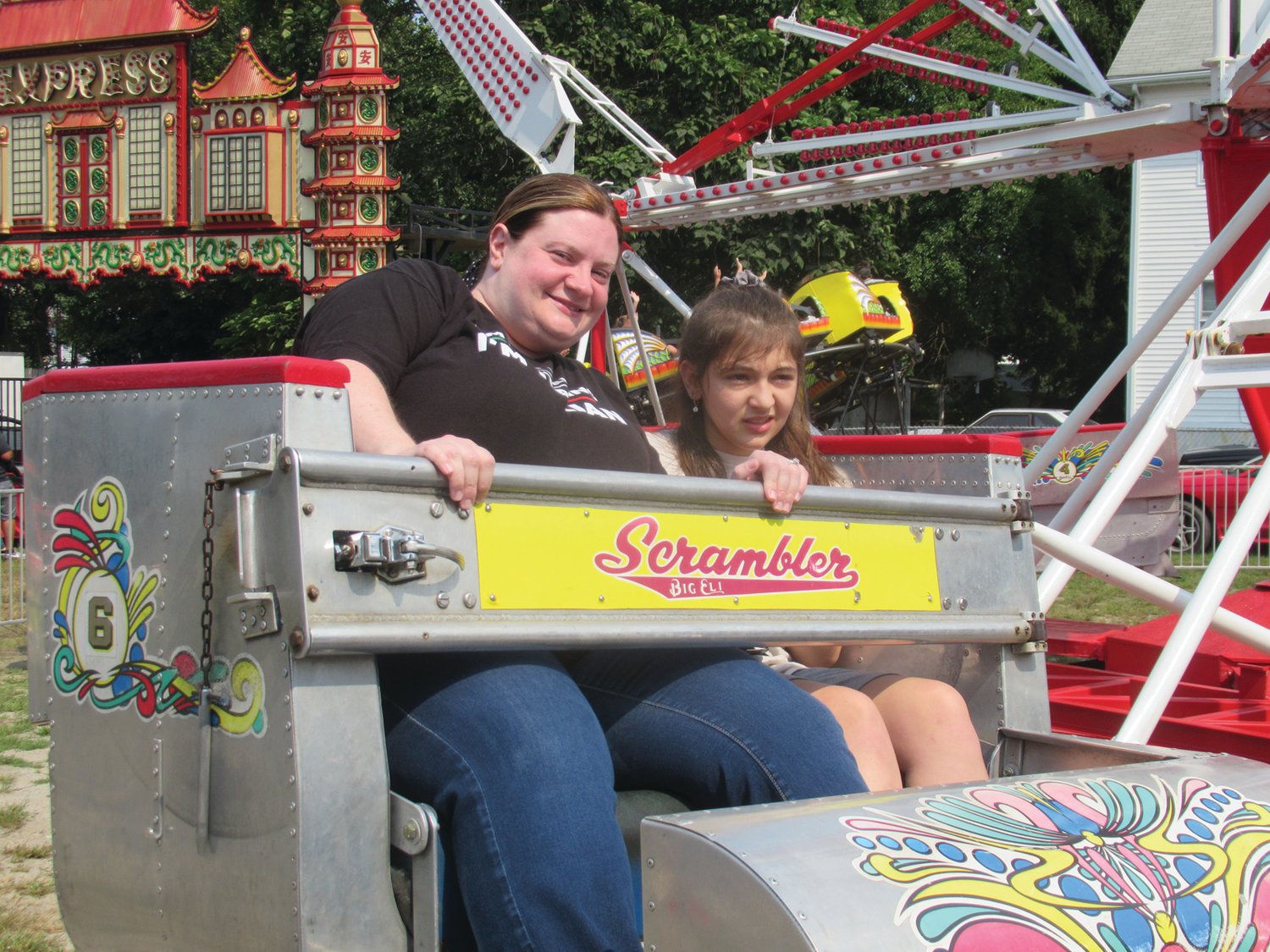 SPECIAL SCRAMBLE: Andrea Aiello (lest) and Olivia Miele enjoy a brief stop during this ride in Rockwell Amusements famed Scrambler.